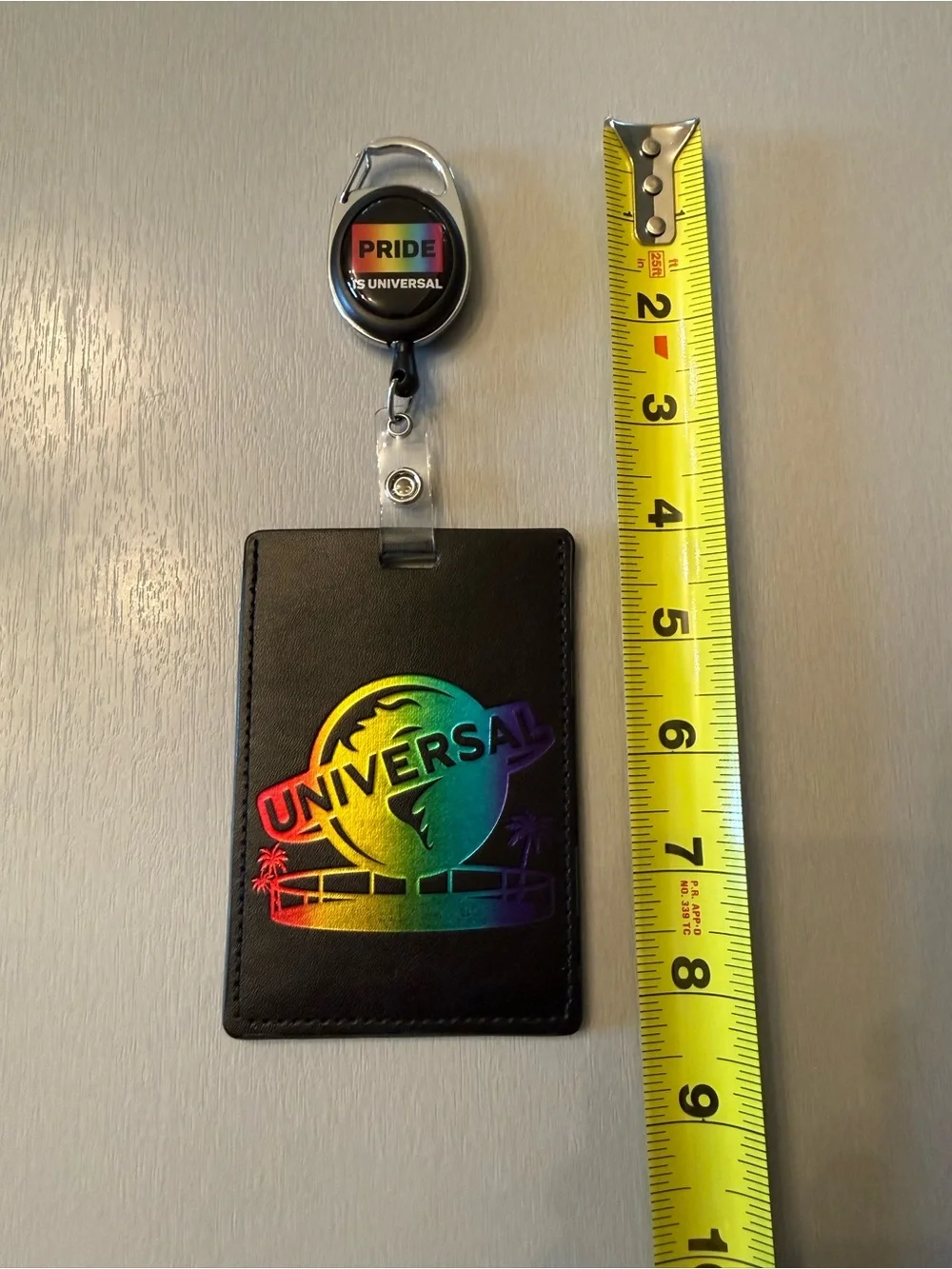 Universal Black Badge Holder with Rainbow Holographic Logo and Pride Reel